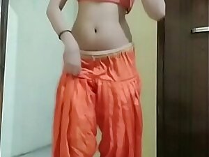 Indian girl Nidhi doing belly dance at home